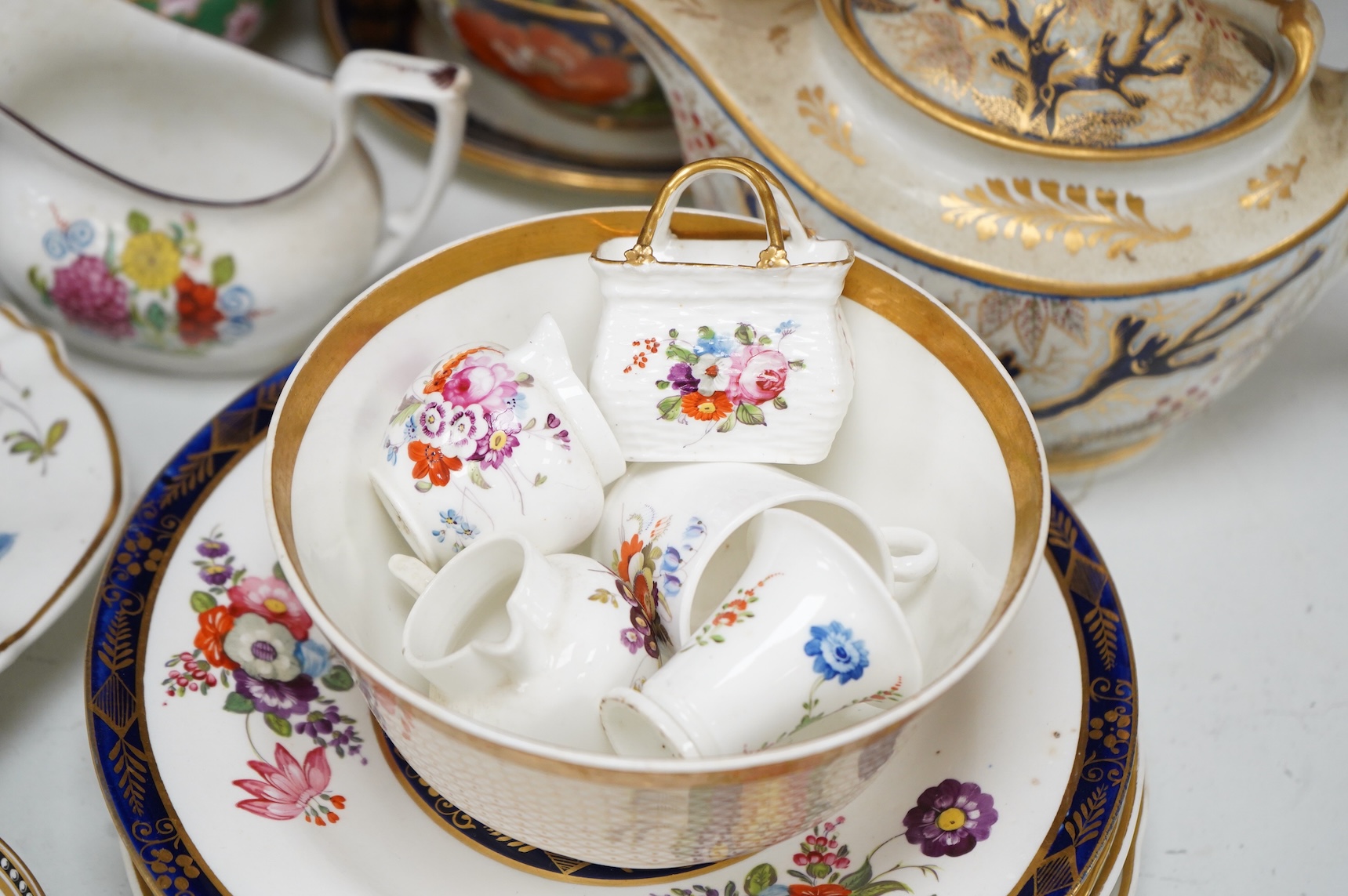 A collection of early 19th century English porcelain tea, dessert and dinner wares including Derby dessert plates, Bloor Derby, Barr Flight & Barr plate, Spode, Coalport etc.